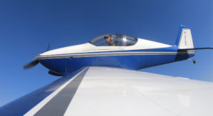 Photo of a man flying a single-seater plane